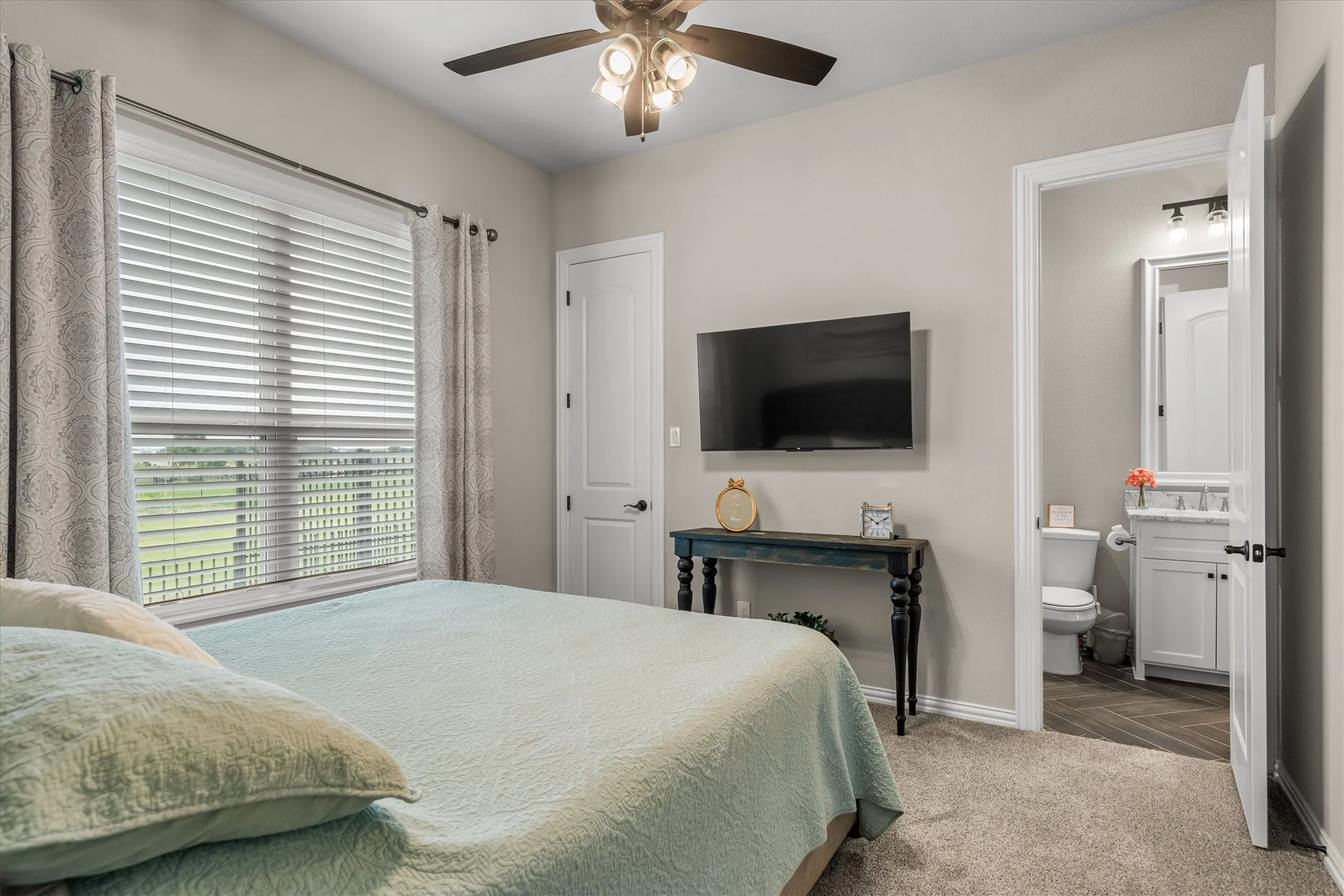 The second guest room has a walk in closet and is an ensuite to the bathroom next to the game room.