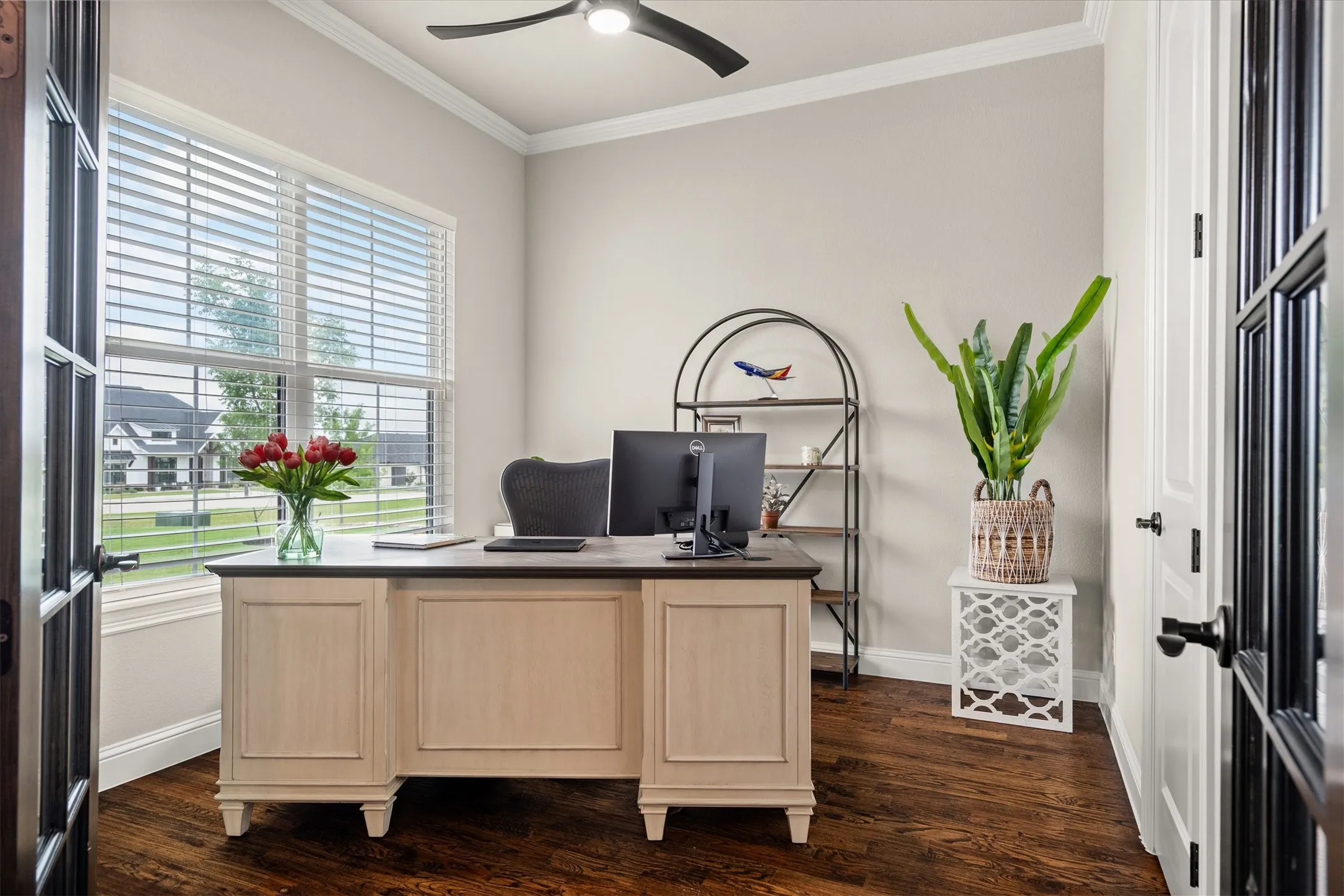 The dedicated office has French doors for privacy and overlooks the front of the property.