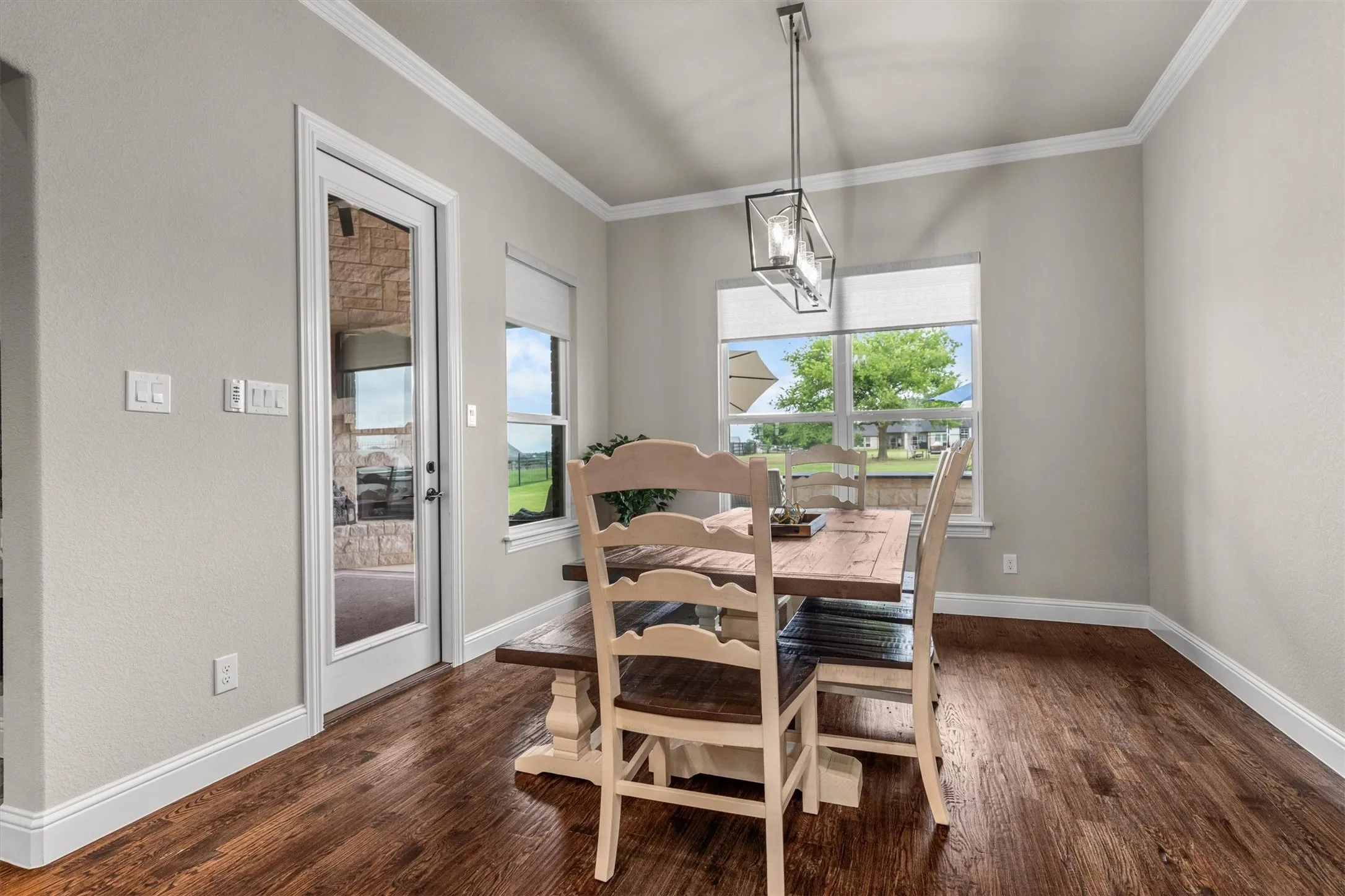 the large dining area is still open to living and kitchen areas and overlooks the back of the property.