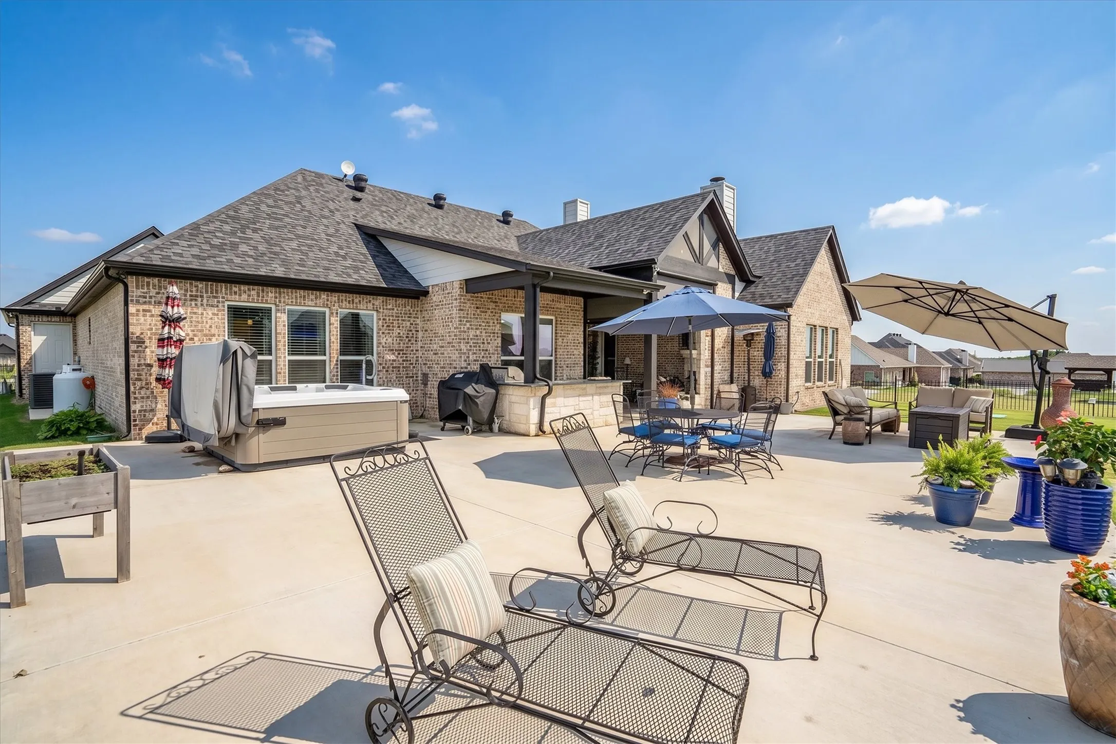 The expansive 48x32 patio provides space for multiple seating areas, entertaining, outdoor dining, or recreation.
