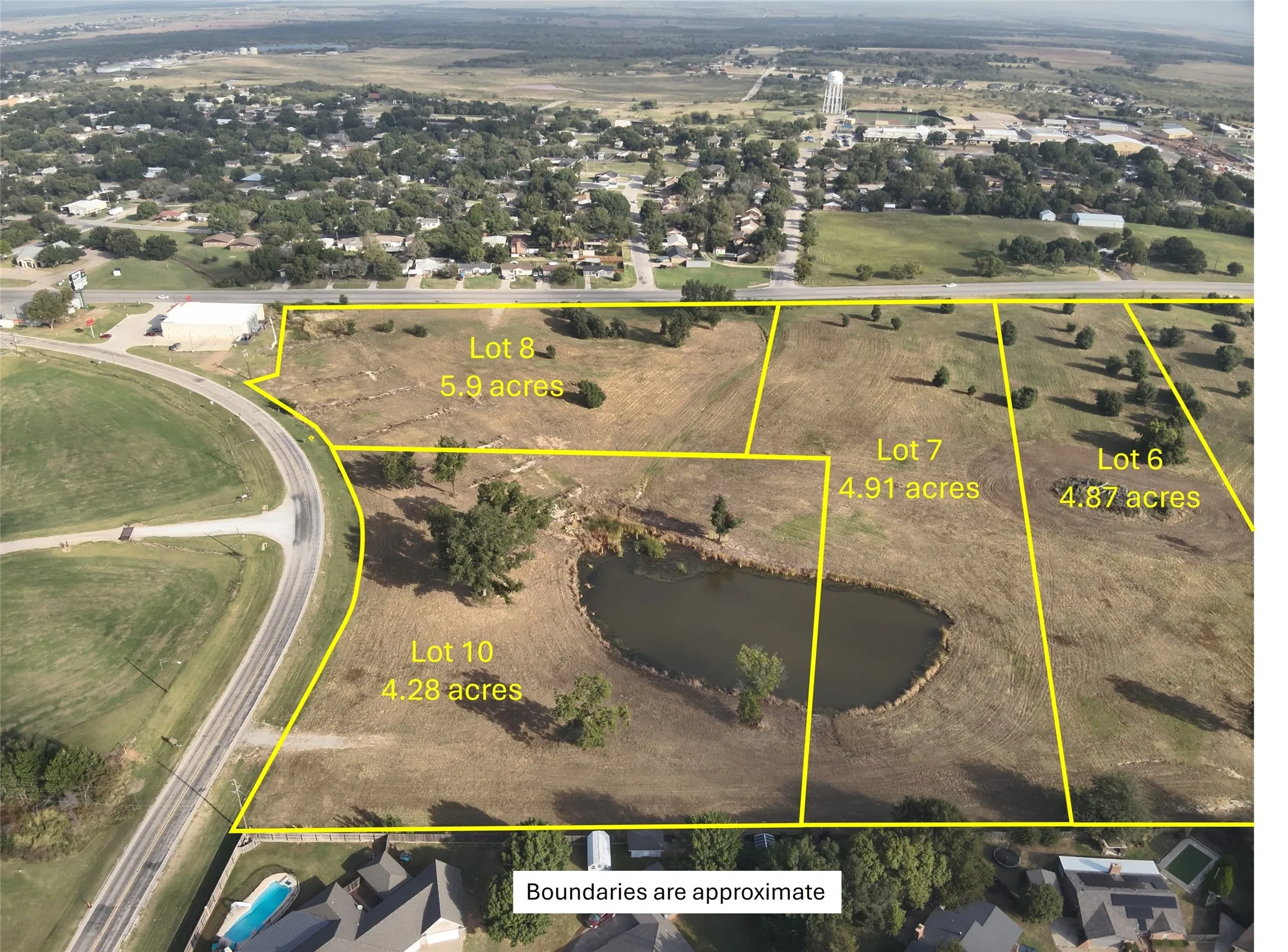 Aerial view of property's location with a large body of water and property boundaries highlighted