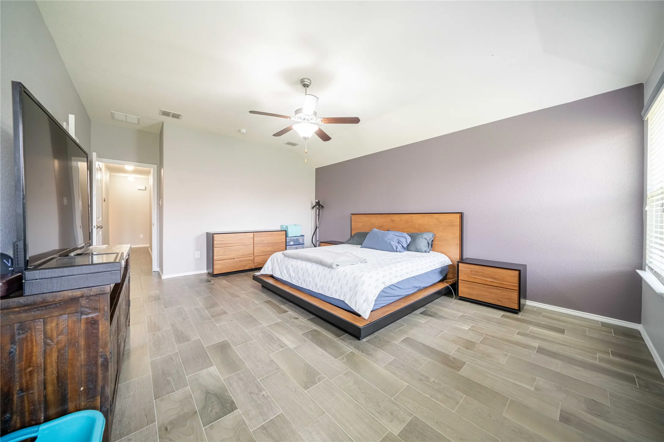 Bedroom featuring light hardwood / wood-style flooring and ceiling fan
