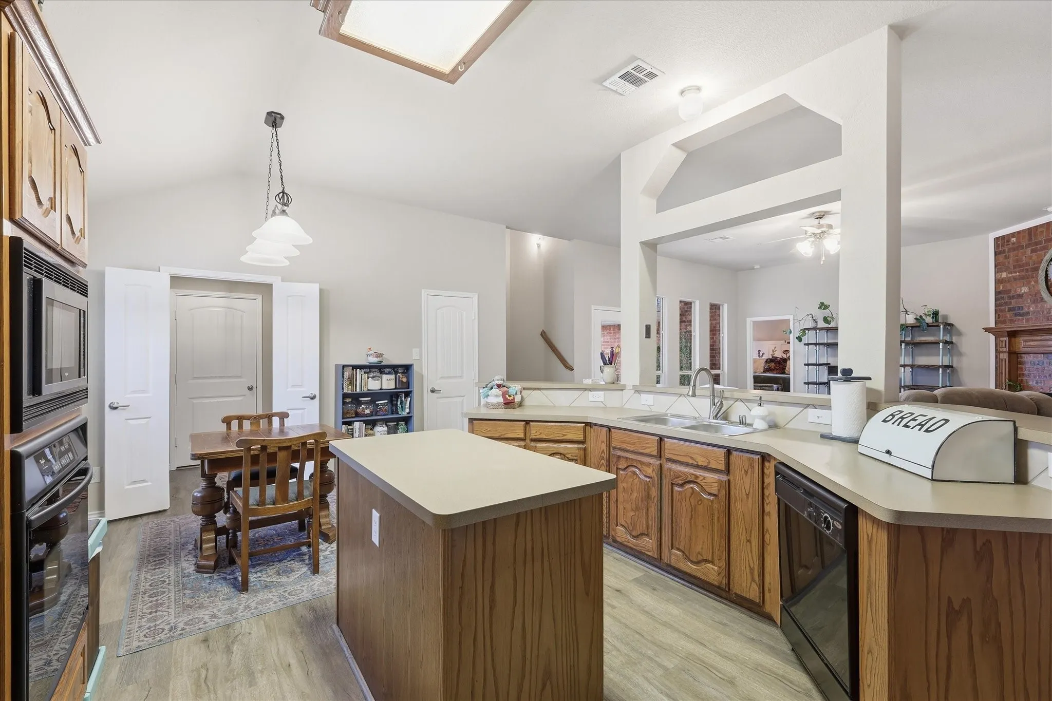 Kitchen featuring natural wood countertops and center island.