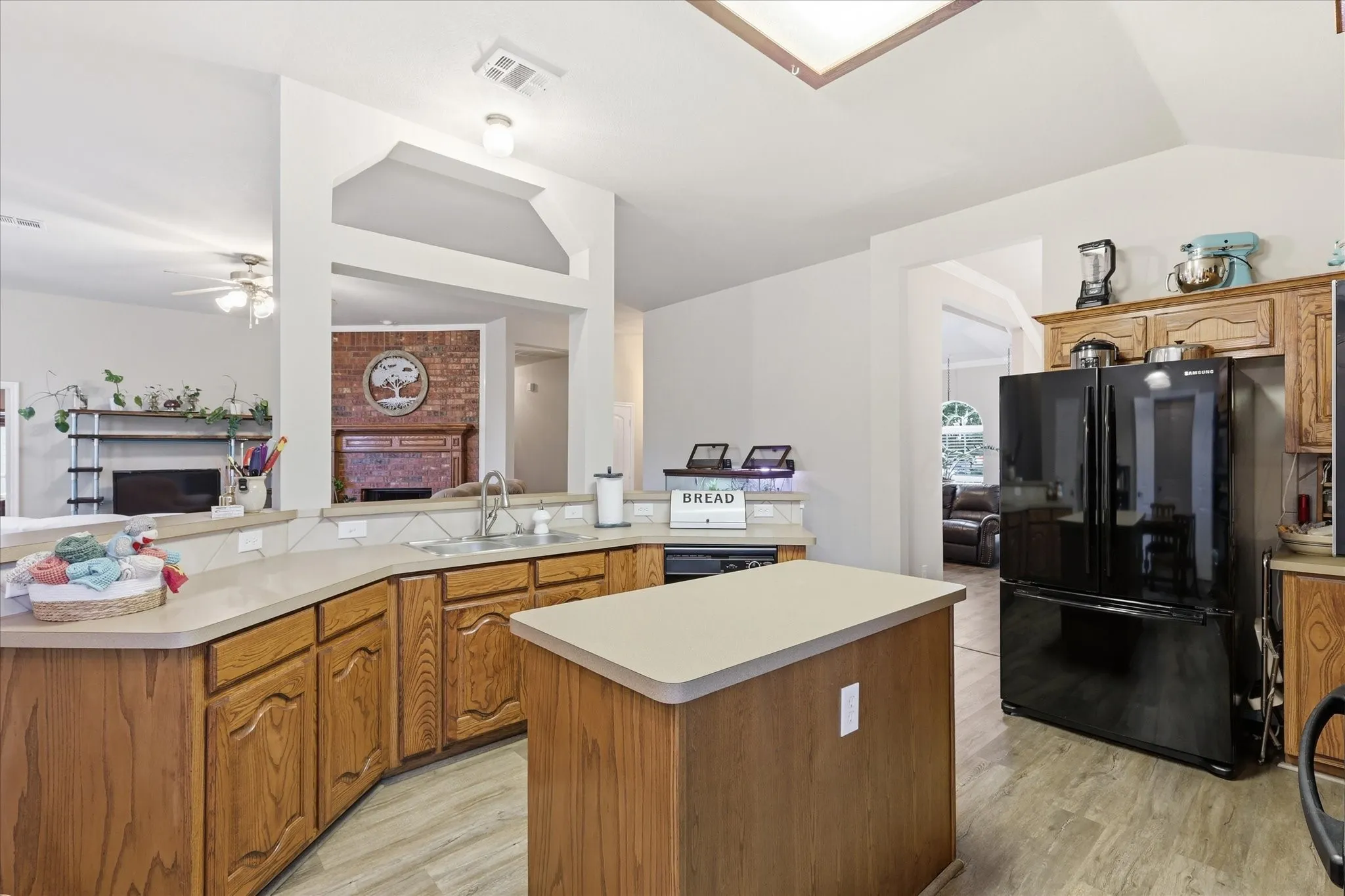 Kitchen featuring natural wood countertops and center island.