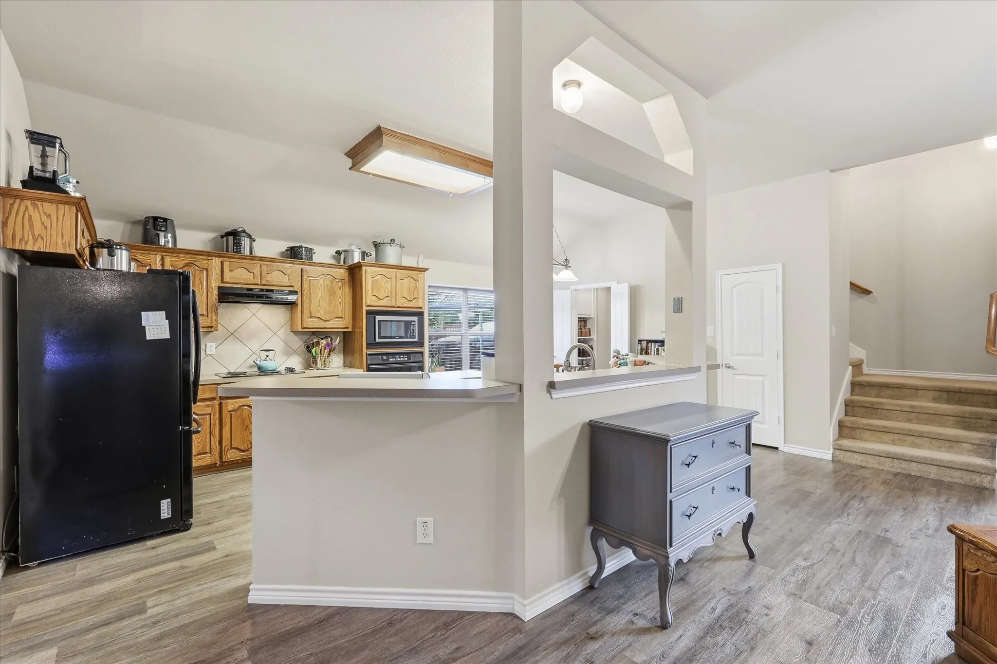 Kitchen featuring natural wood countertops and center island.