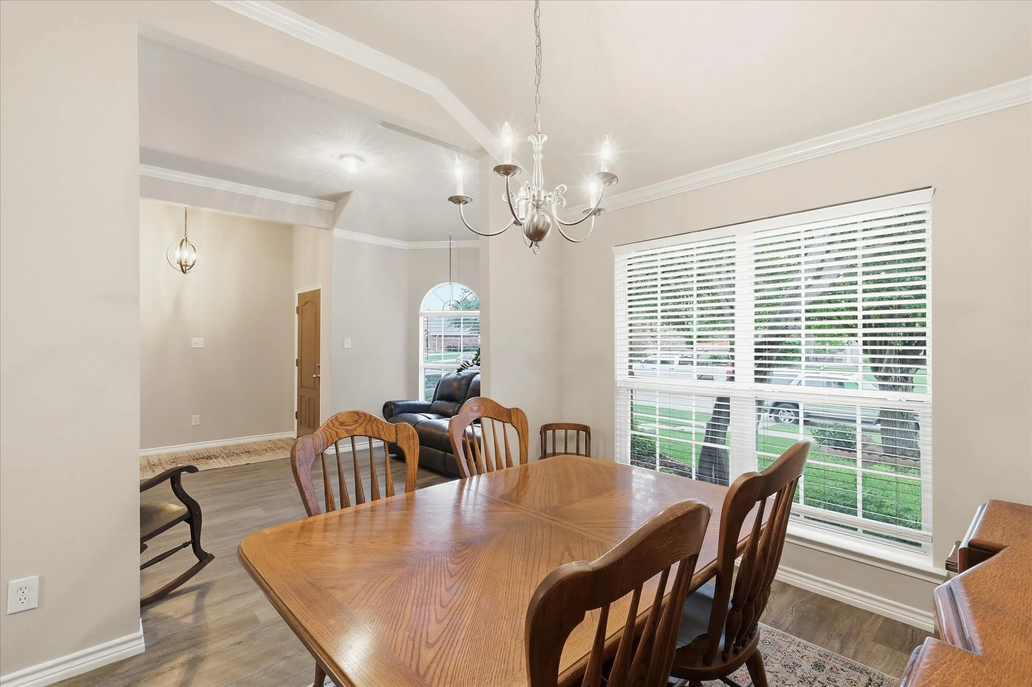 Dining featuring view of front yard and natural light.