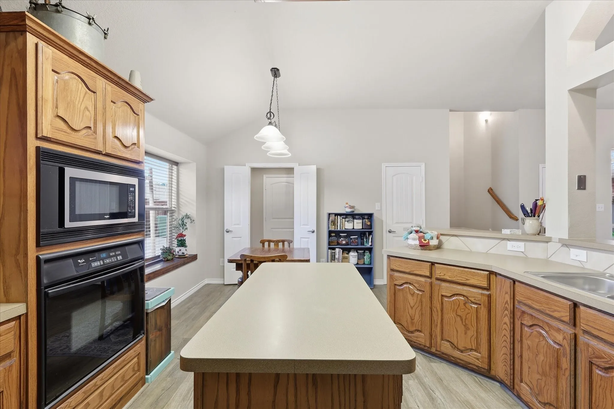 Kitchen featuring natural wood countertops and center island.