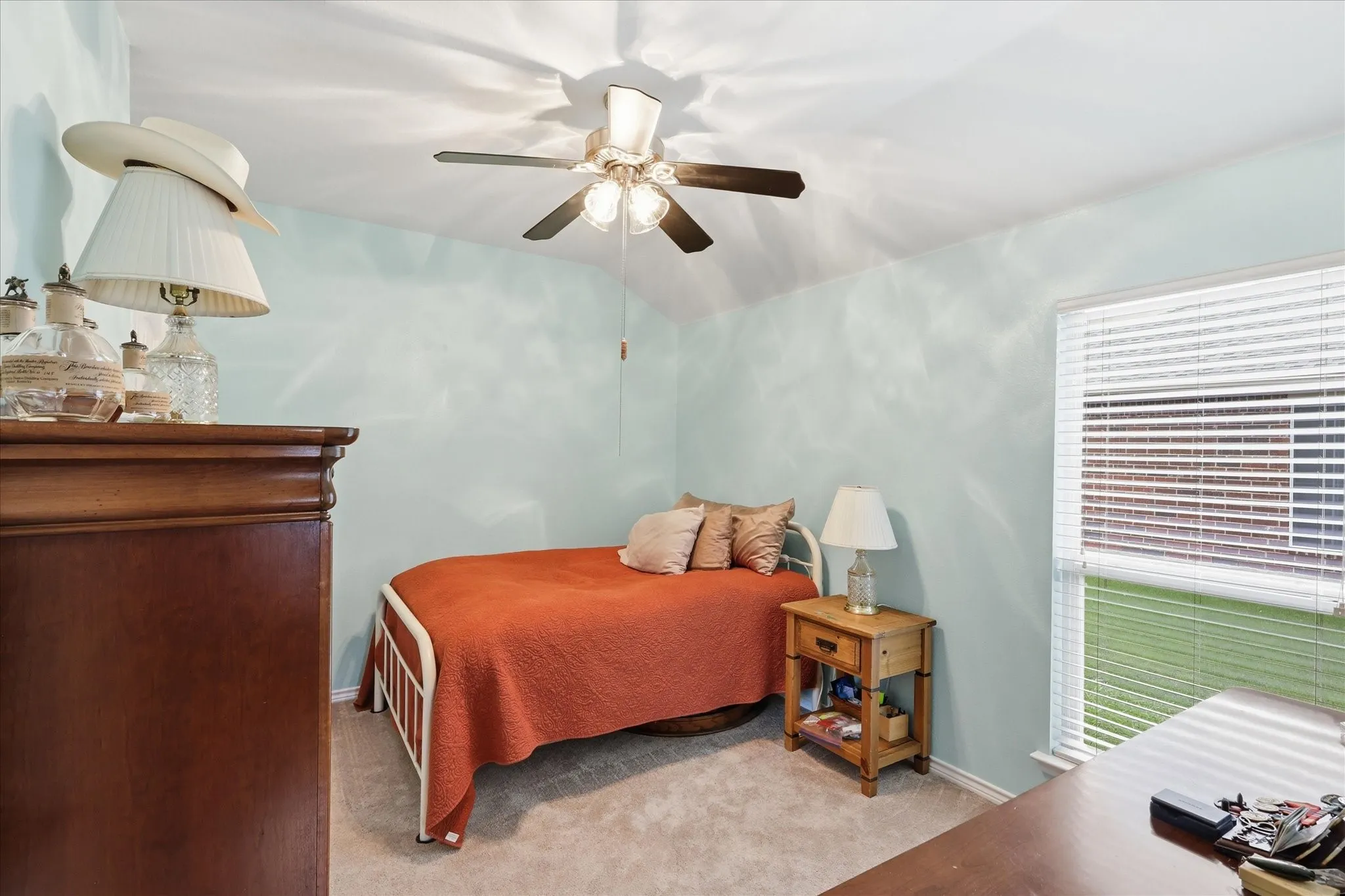 Secondary bedroom featuring ceiling fan