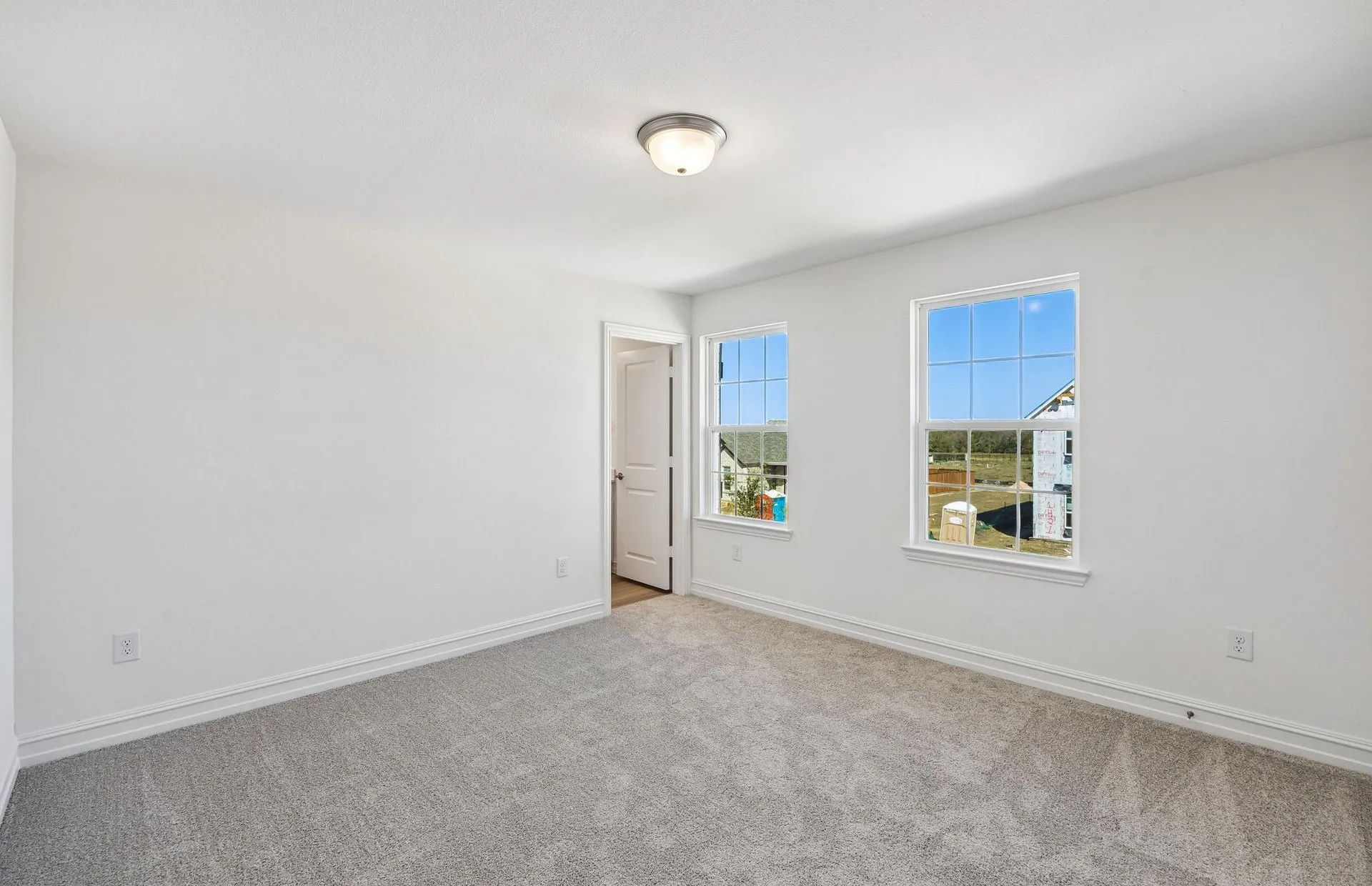 Secondary bedroom with large windows