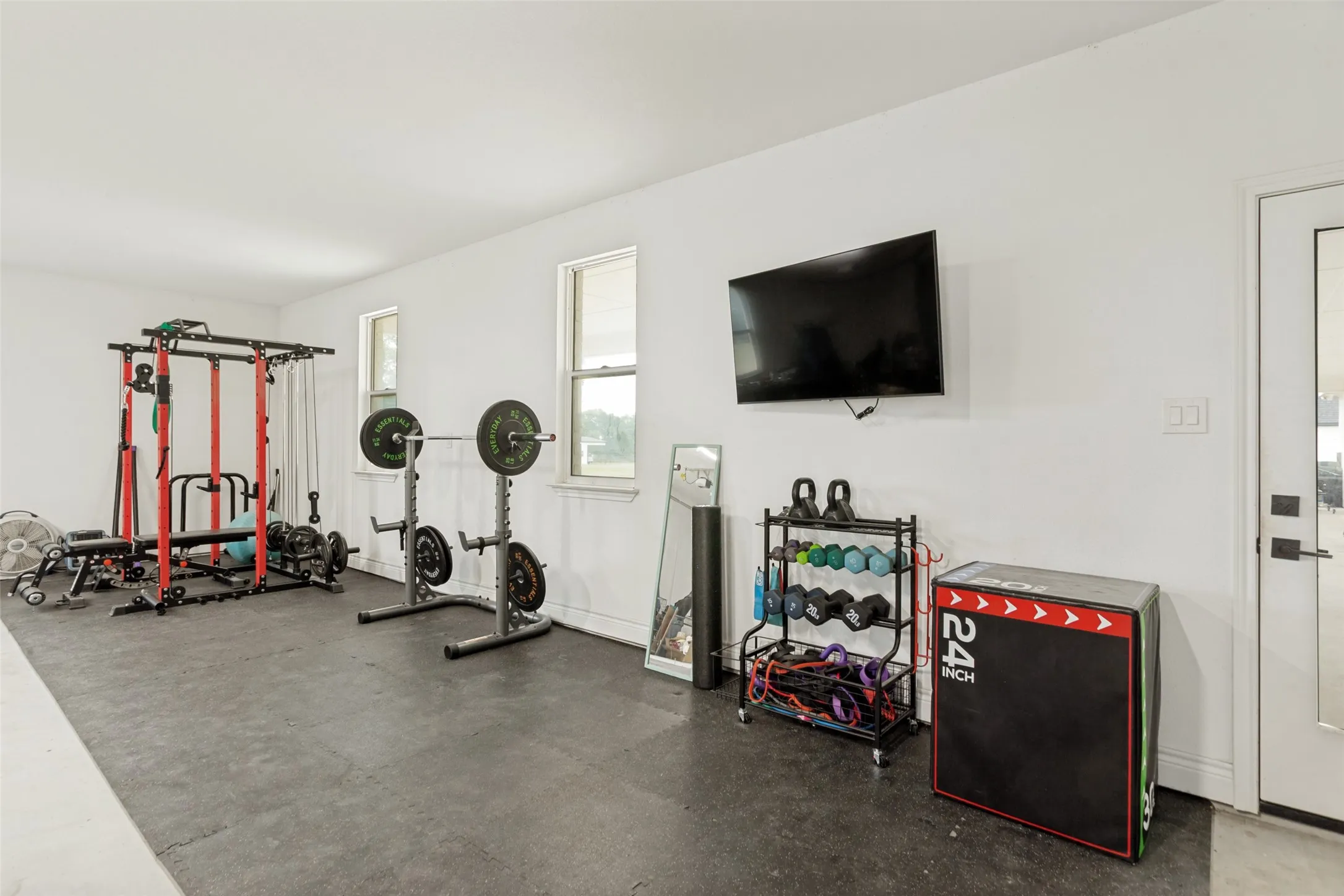 The huge 33’ x 29’ 3 car garage was designed and built to accommodate this dedicated work out area with plenty of room for equipment and accessories.  The space could also be used for other storage purposes, workbench, etc.