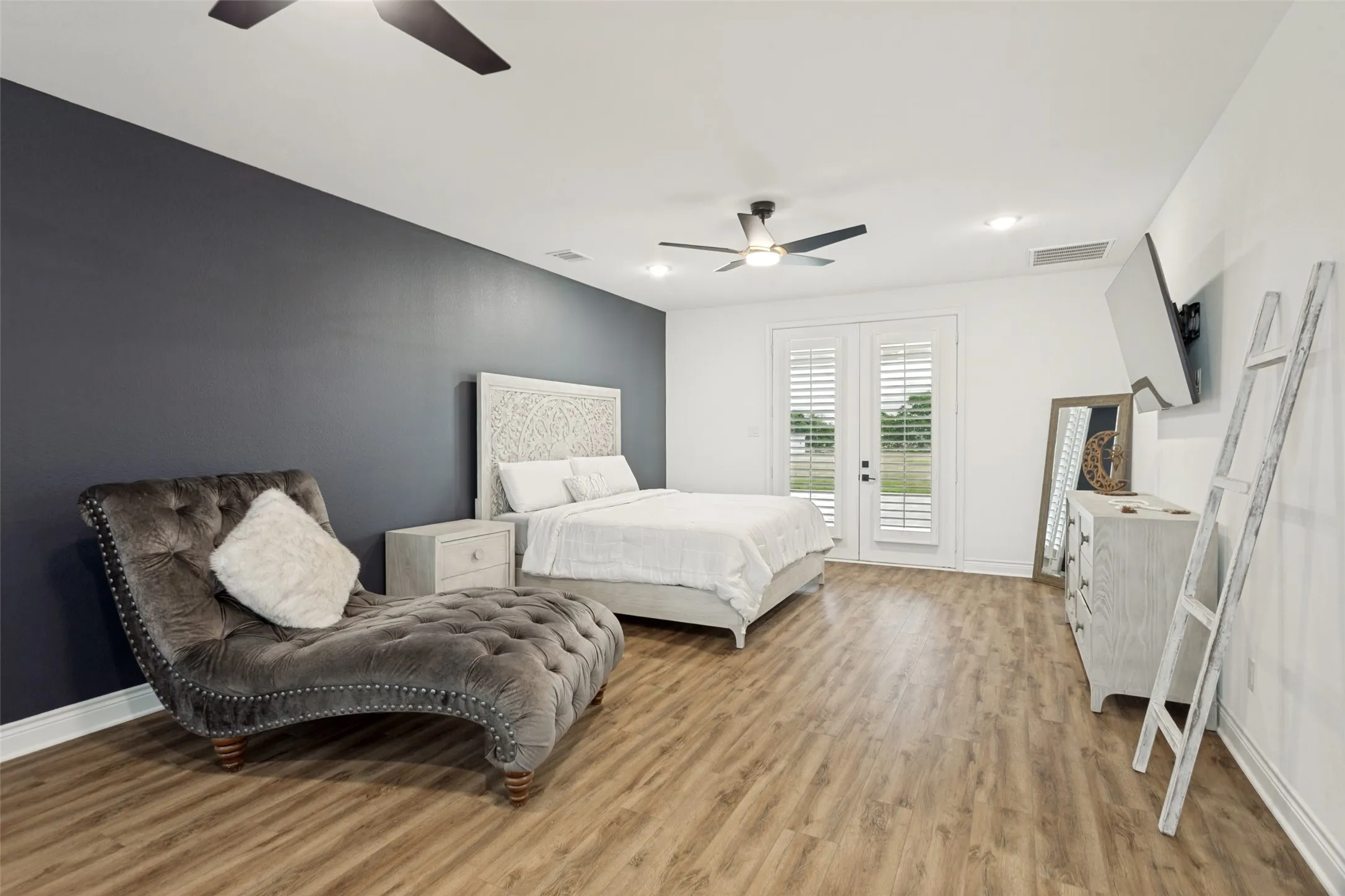 Another view of the primary bedroom