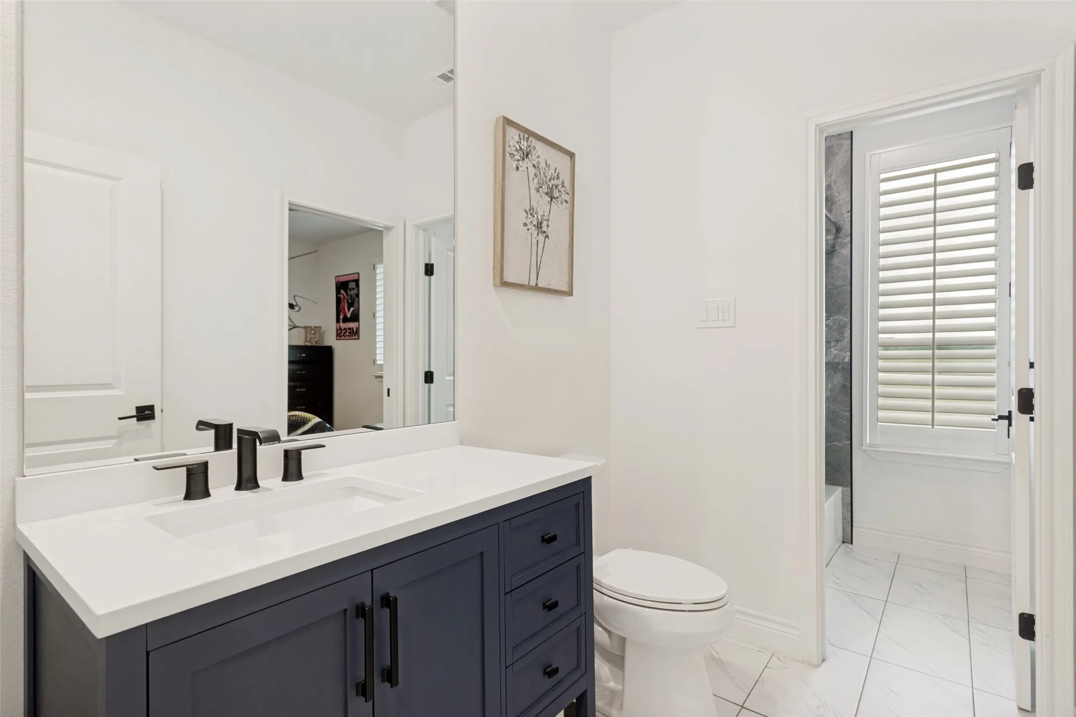 Third full bathroom with modern hardware and plumbing fixtures