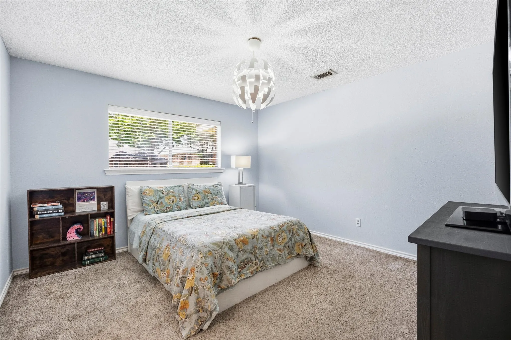 Beautiful guest bedroom includes room closet