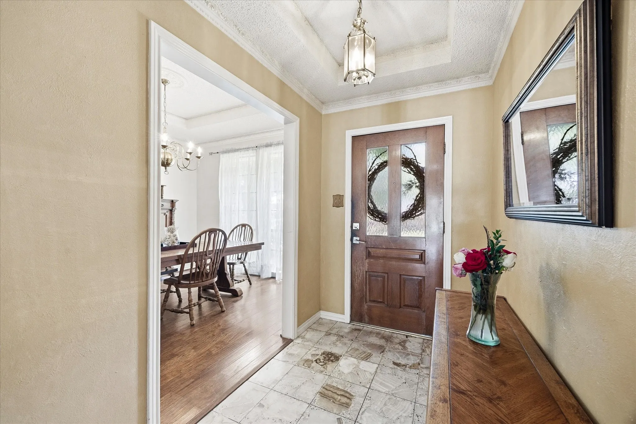 Stunning entry opens onto dining area