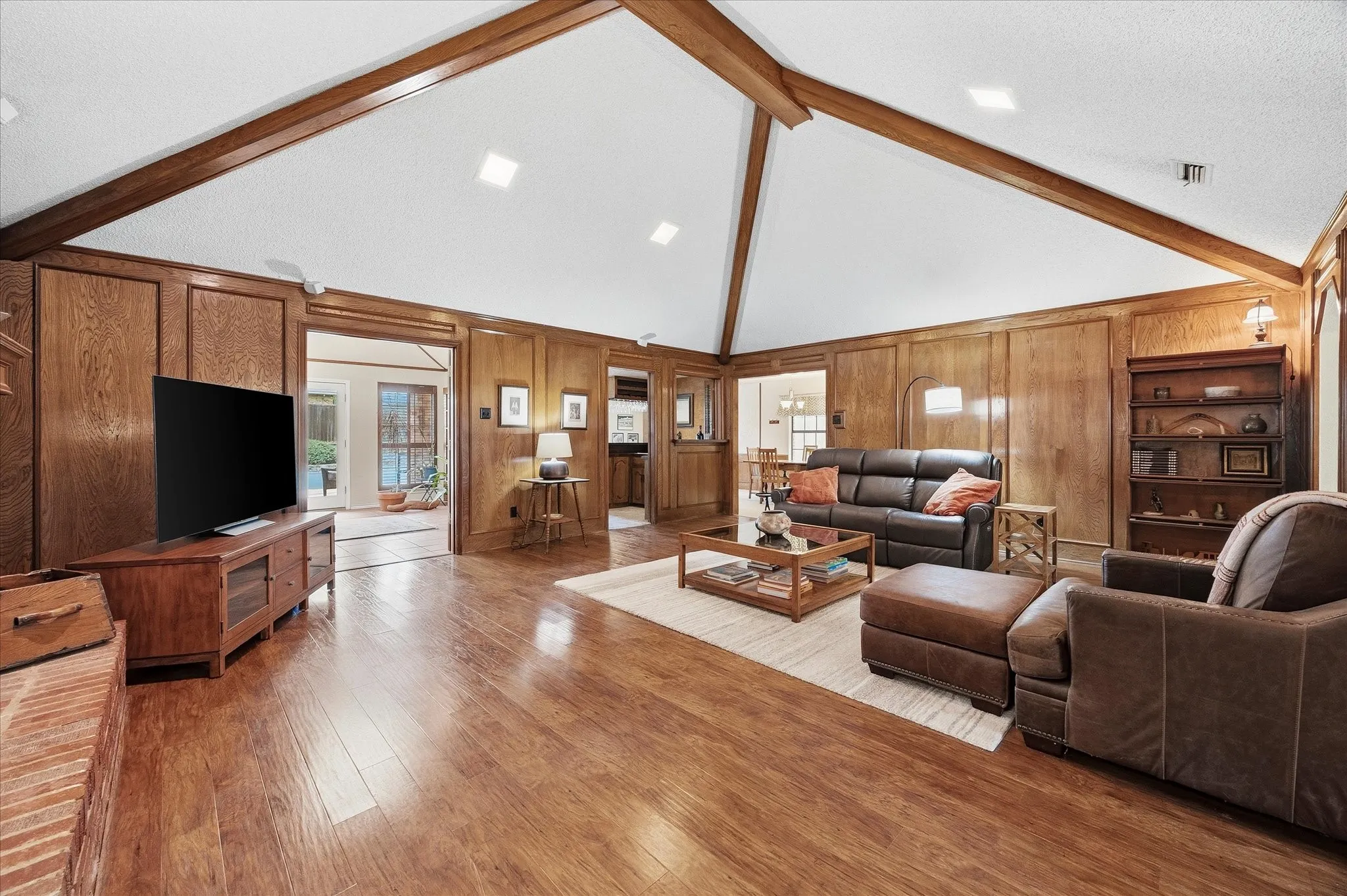 Family room opens onto bonus room and kitchen