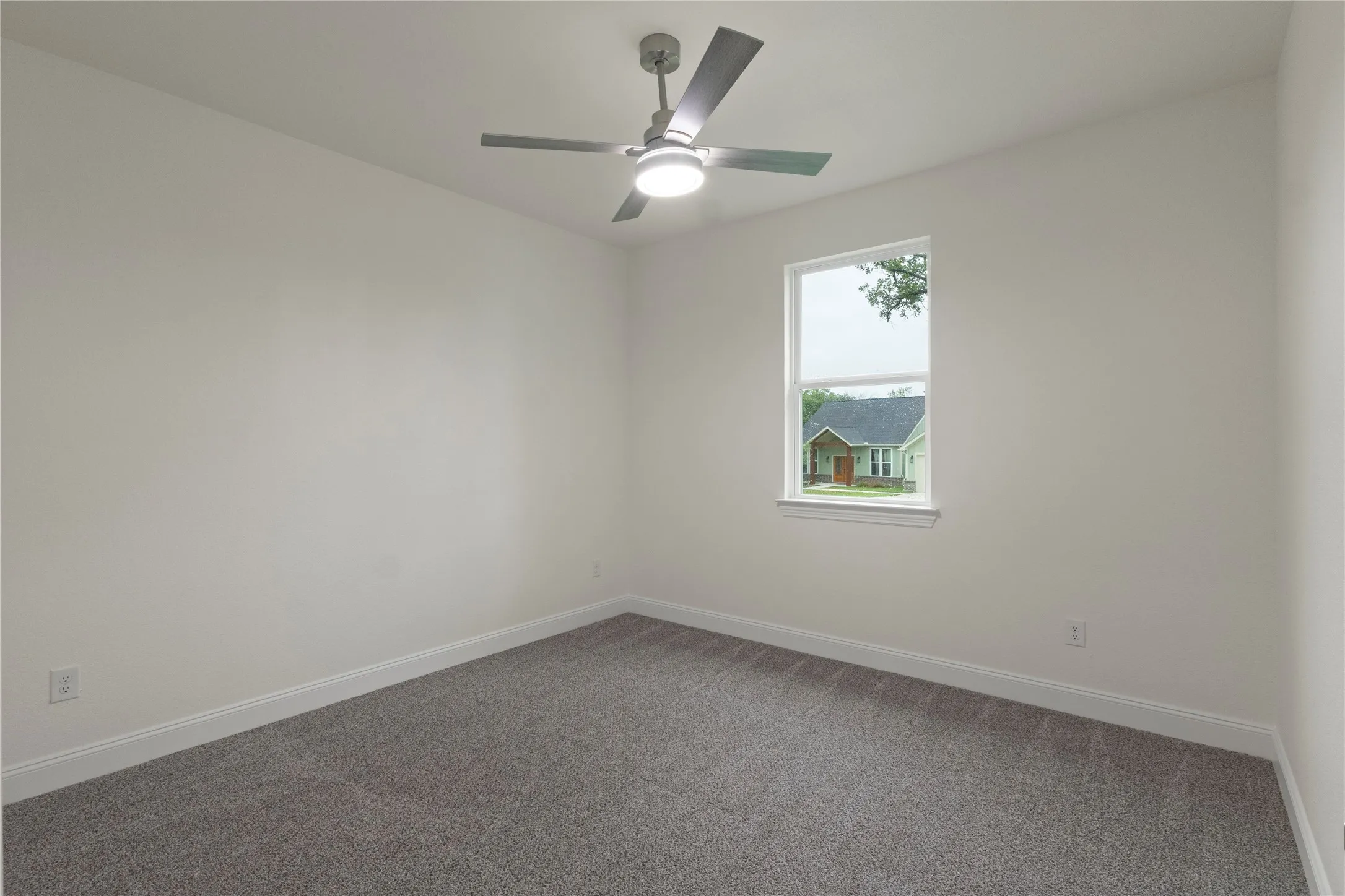 Neutral-toned wall paint and grey carpeting create a versatile foundation