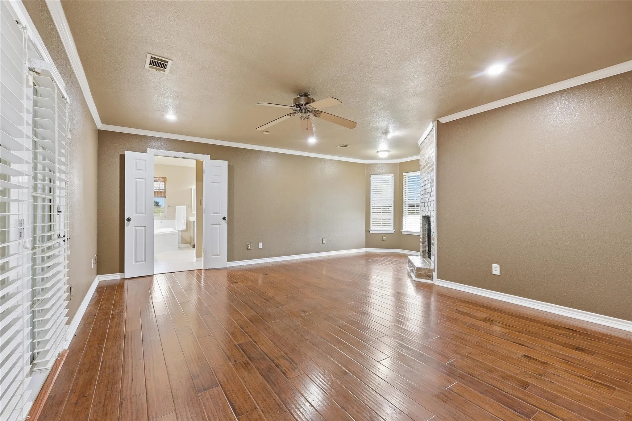 Owner's suite with access to enclosed patio