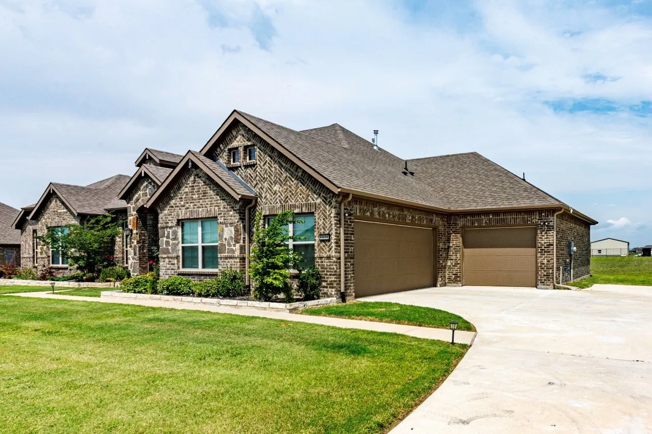 Stone and brick exterior with a multi-gabled roofline