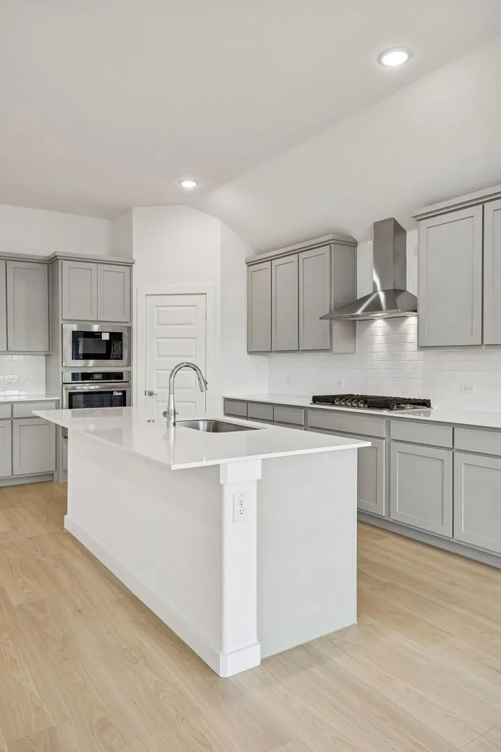 Kitchen in the Gilmour II home plan by Trophy Signature Homes – REPRESENTATIVE PHOTO