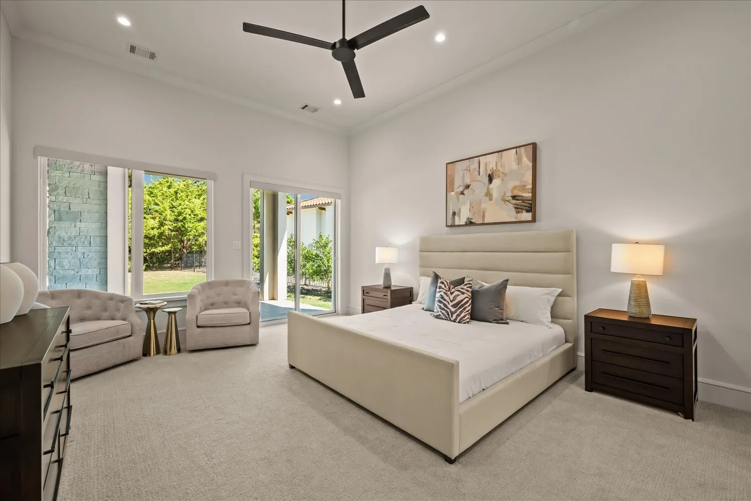 Recessed lighting, crown molding, ceiling fan, carpeted flooring, and sliding glass doors