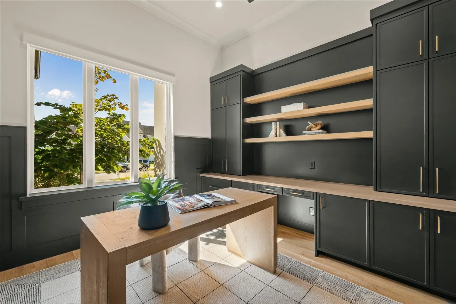 Built-in cabinetry and open shelving with wood-finish countertops