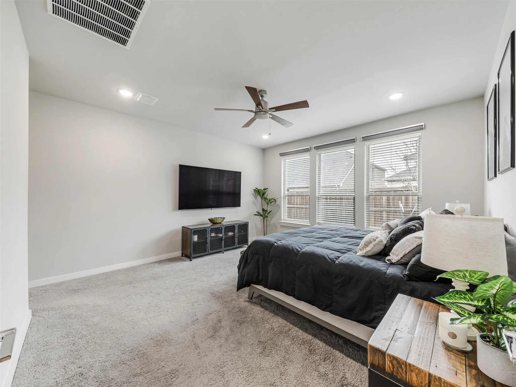 Tall ceilings, recessed lights and blackout shades.