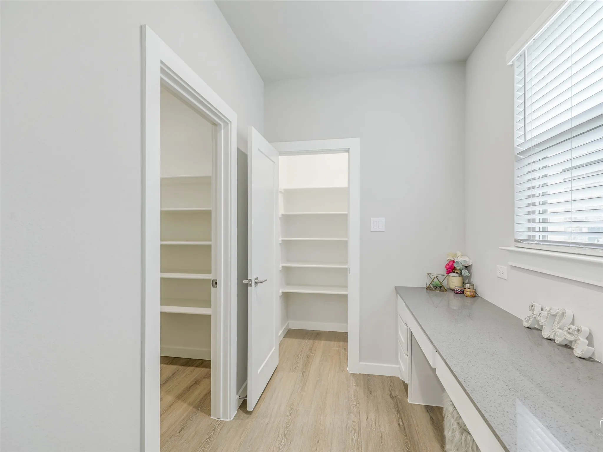 Home management area with walk in closet.