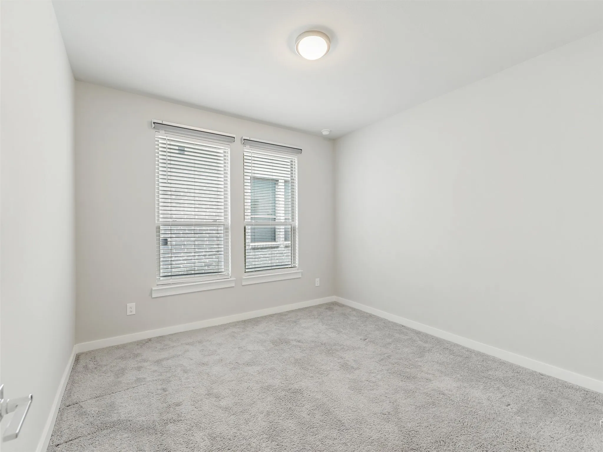 Auto blackout shades are included with this secondary bedroom on the 1st floor.
