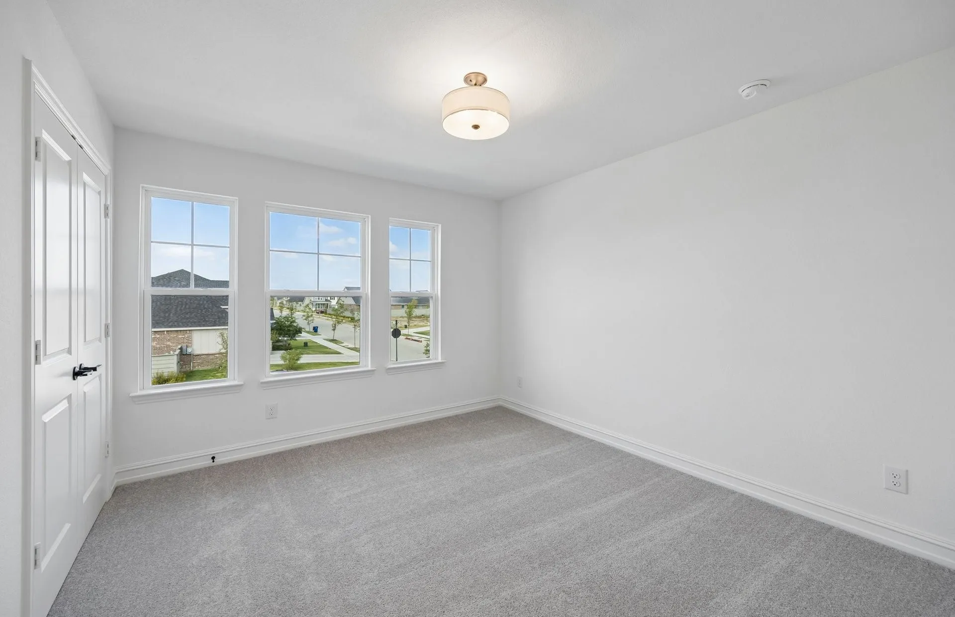 Secondary bedroom with large windows