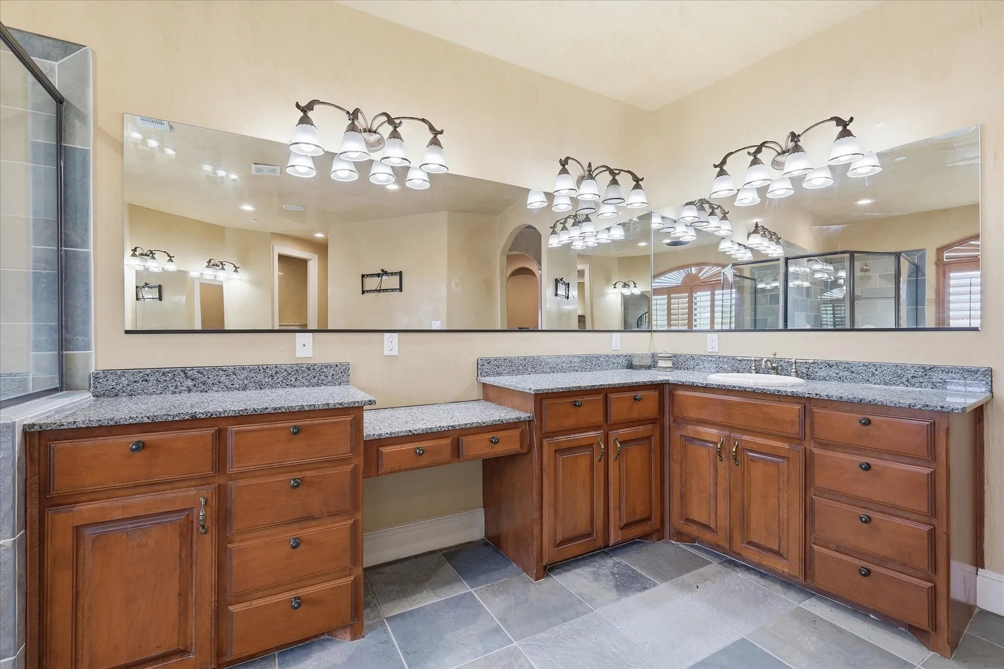 Plenty of counter and cabinet space in the primary bath