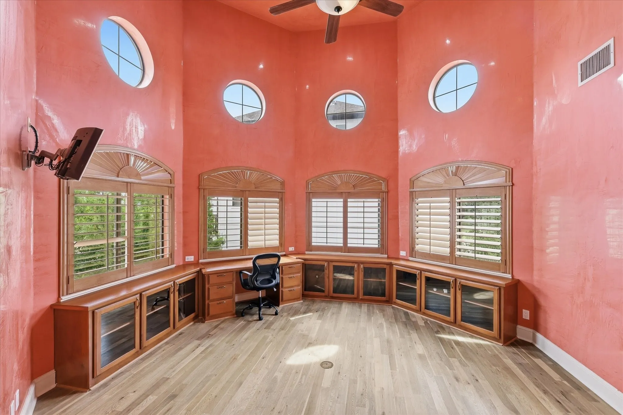 Soaring ceilings in this home office, lots of storage