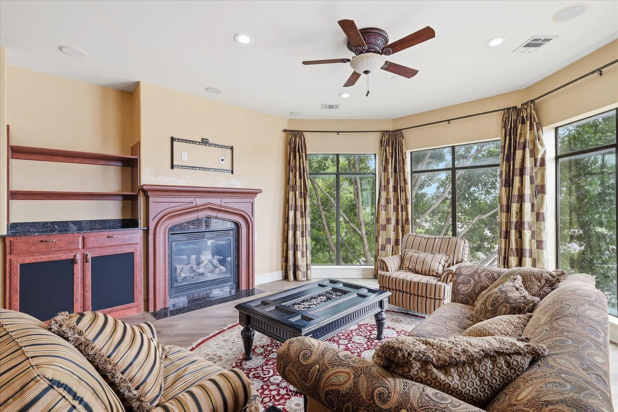 Wall of windows in the living room and enjoy the gas fireplace