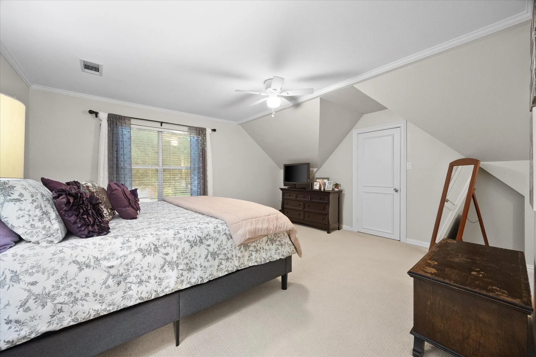 Auxiliary bedroom includes roomy closet and opens onto full bath