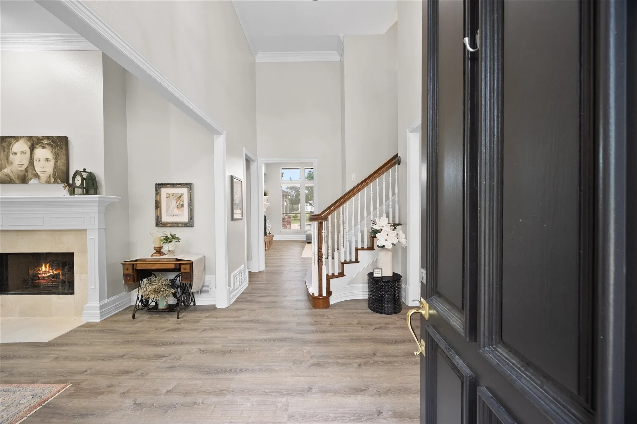 Towering ceilings and impressive staircase welcome your arrival
