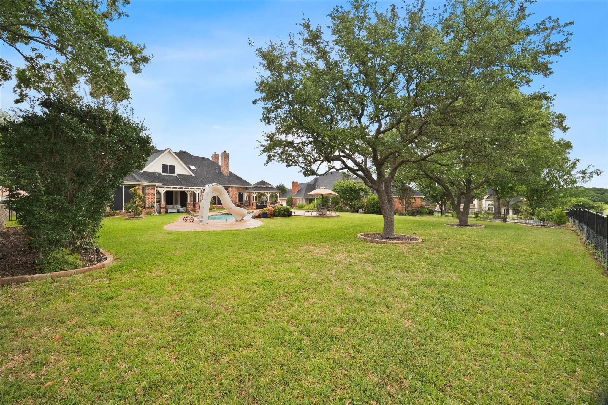 Expansive fenced backyard provides plenty of space to run and play!