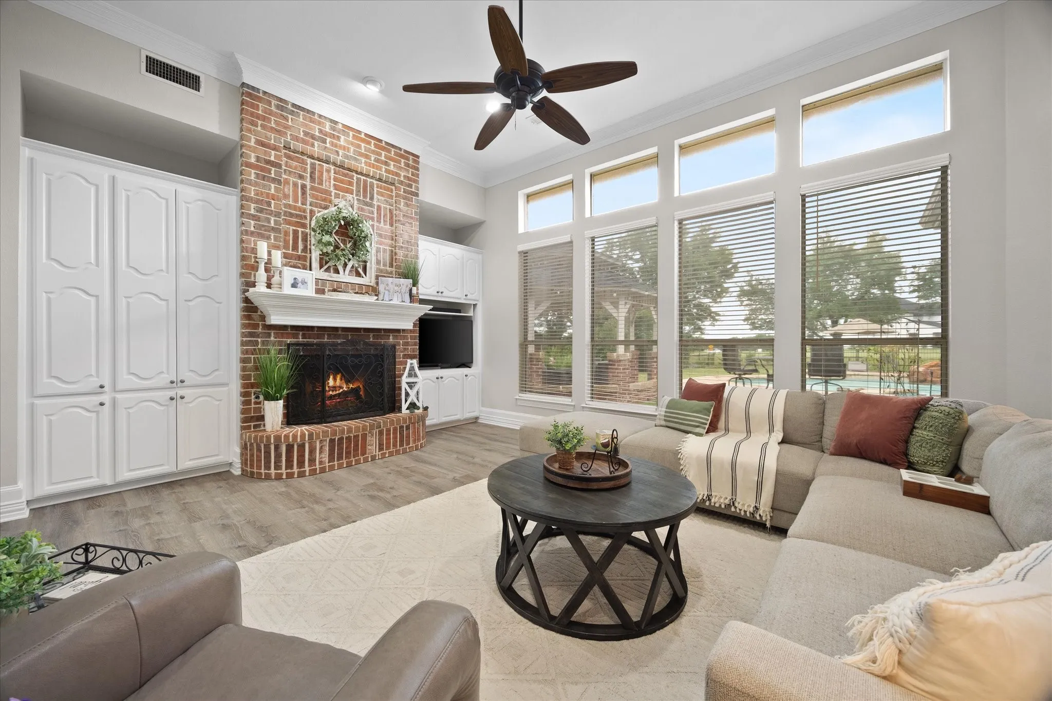 Floor to ceiling windows provide ample lighting and provide stunning views of pool and golf course
