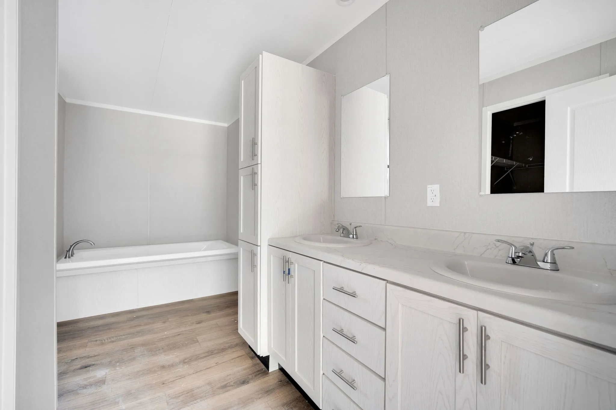 Dual vanity with integrated sinks, chrome fixtures, and a coordinating​​‌​​​​‌​​‌‌​‌‌​​​‌‌​‌​‌​‌​​​‌​​ countertop