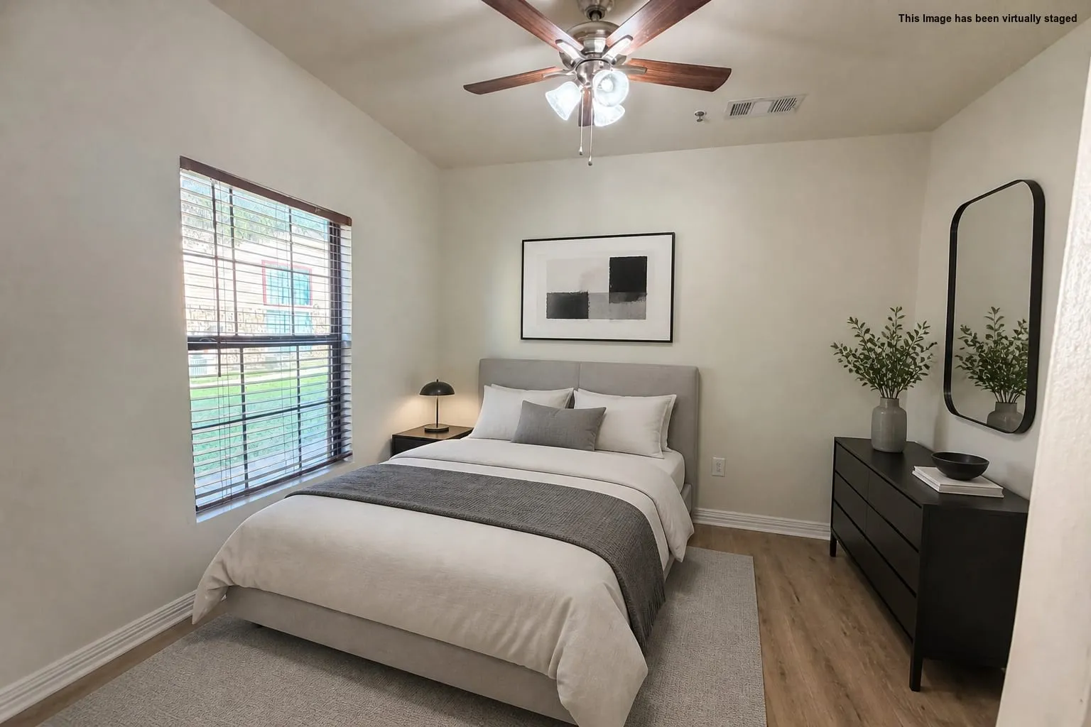 Bedroom 2 with window with wood-finish blinds, wood-finish ceiling fan with integrated lighting, wood-finish flooring, and light-toned wall paint