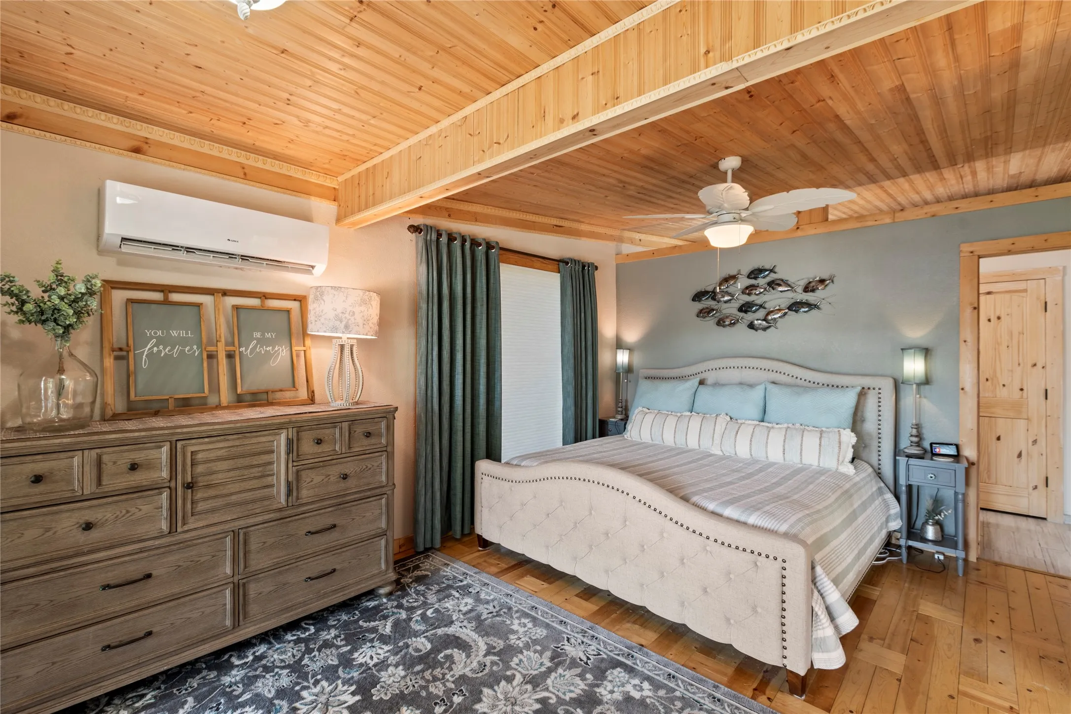Primary suite with private patio access and peaceful waterfront views