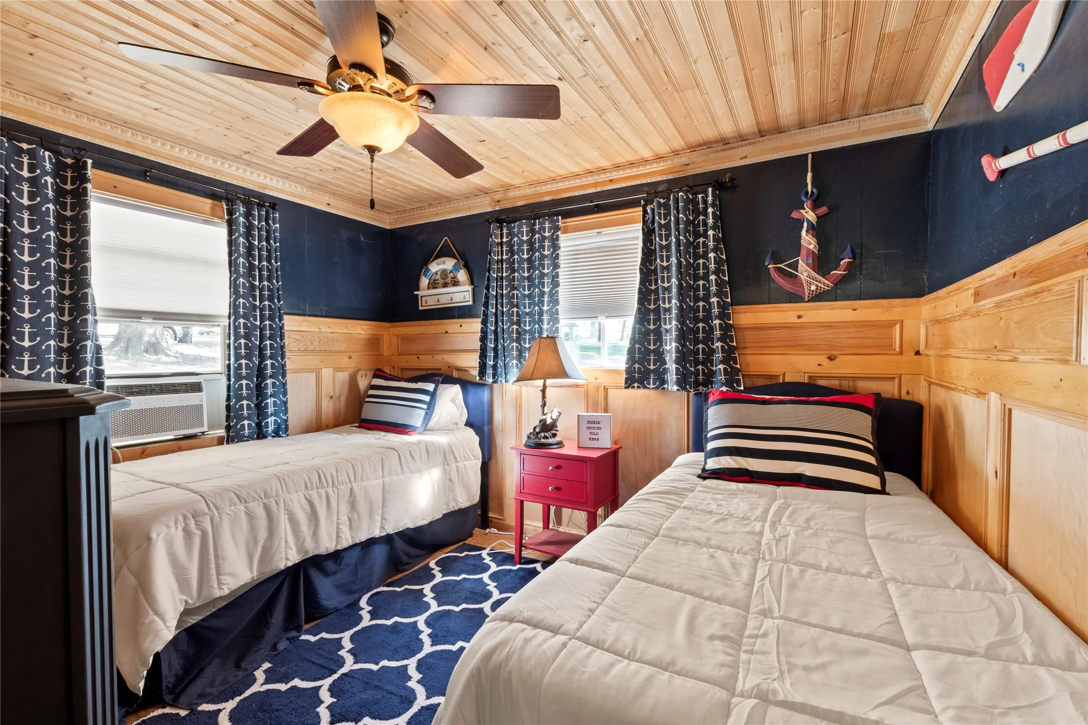 Cozy guest bedroom featuring two twin beds and comfortable accommodations for family or guests