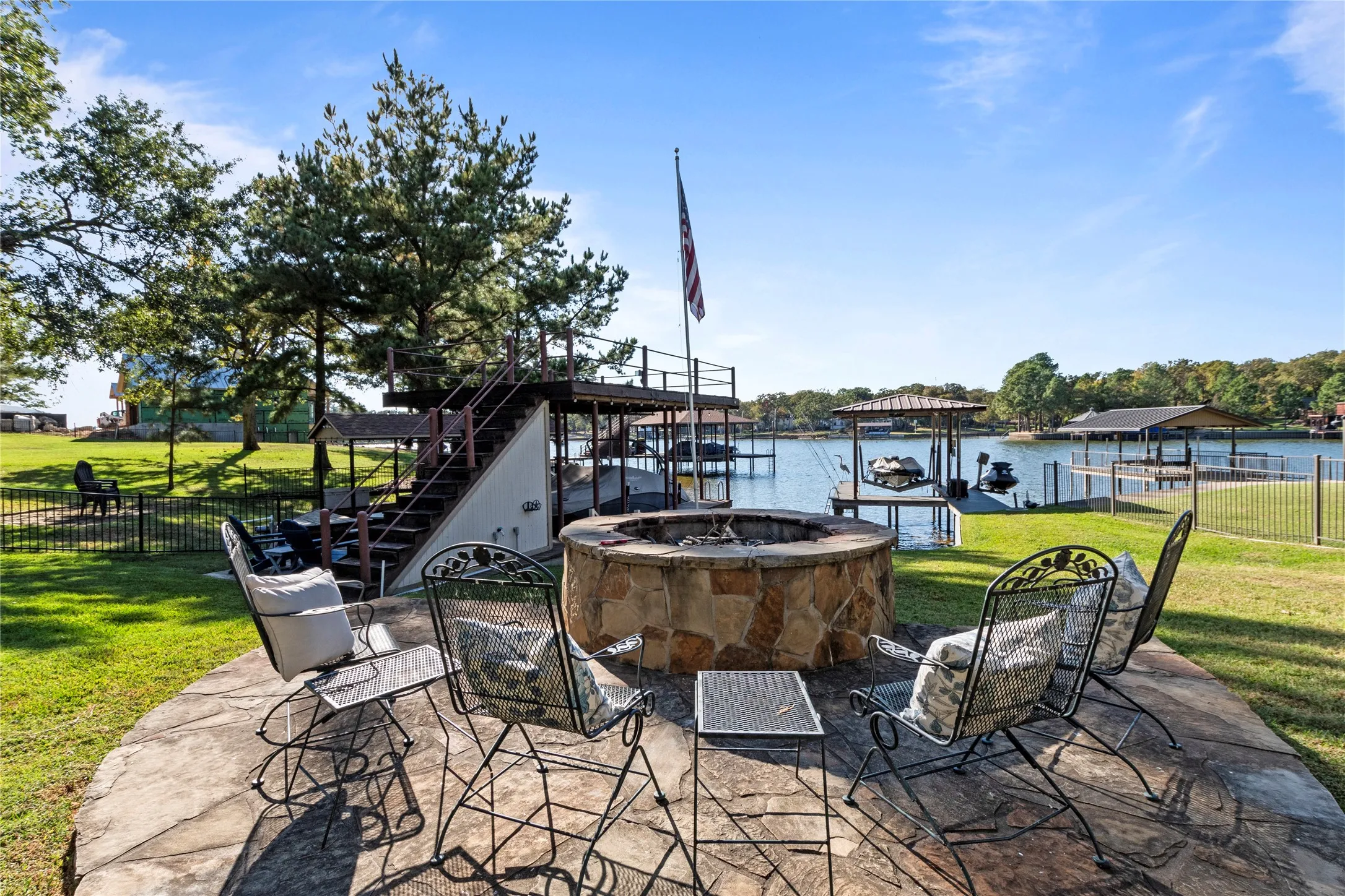 Lakeside fire pit area ideal for gatherings and enjoying the outdoors