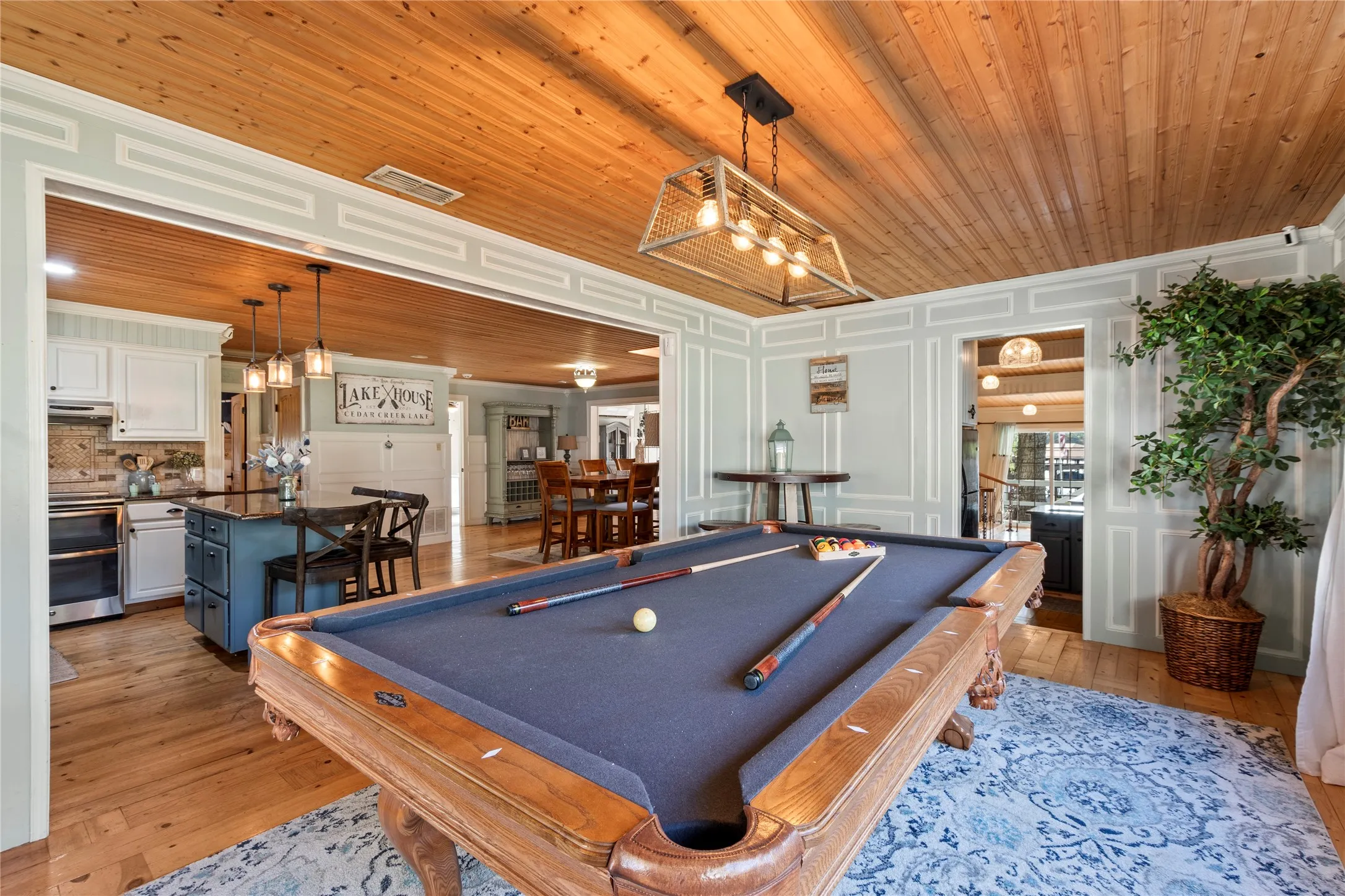 nviting media room, game room, or additional living space with shiplap ceilings
