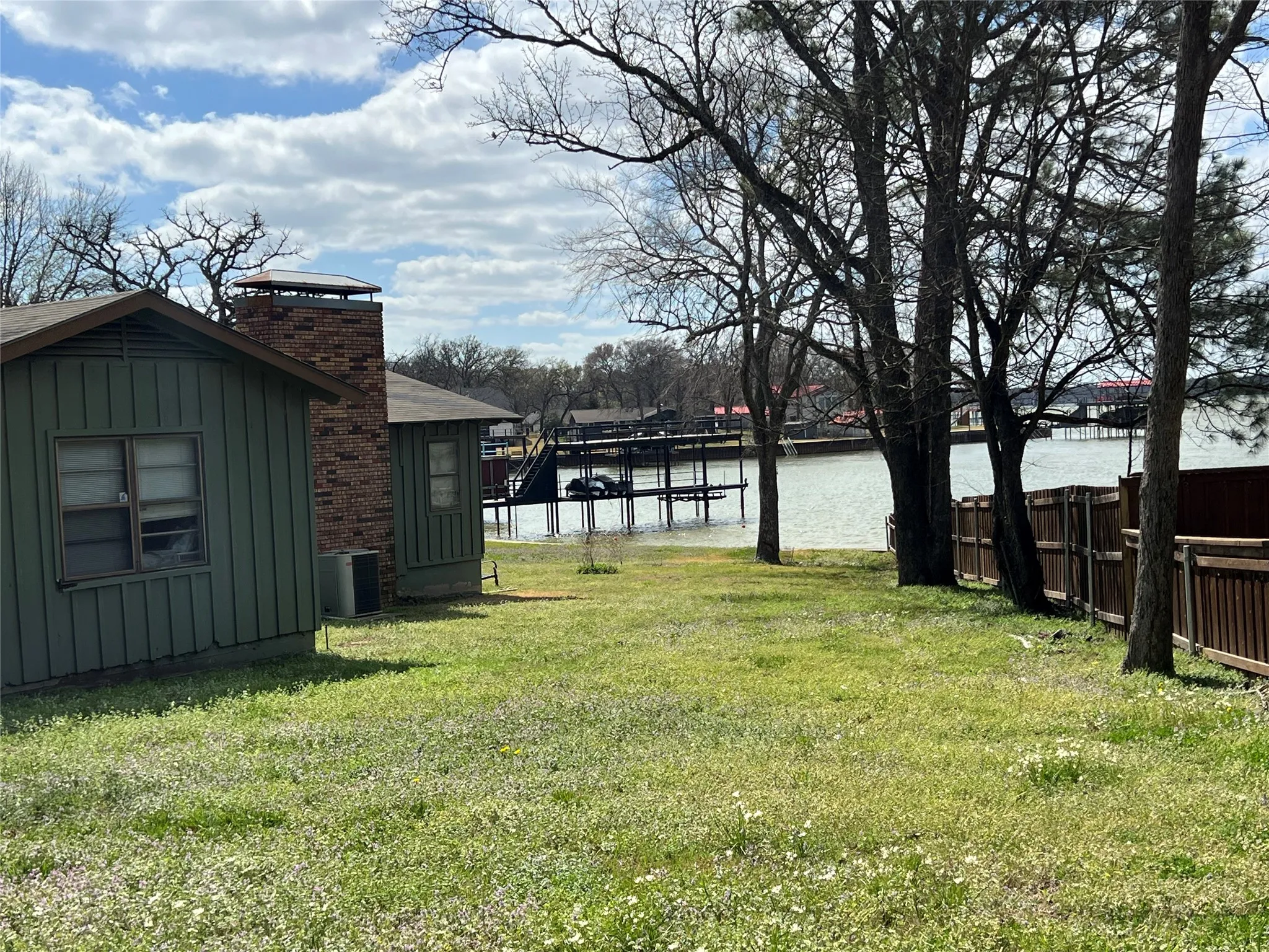 Huge side yard with lake waterside setting