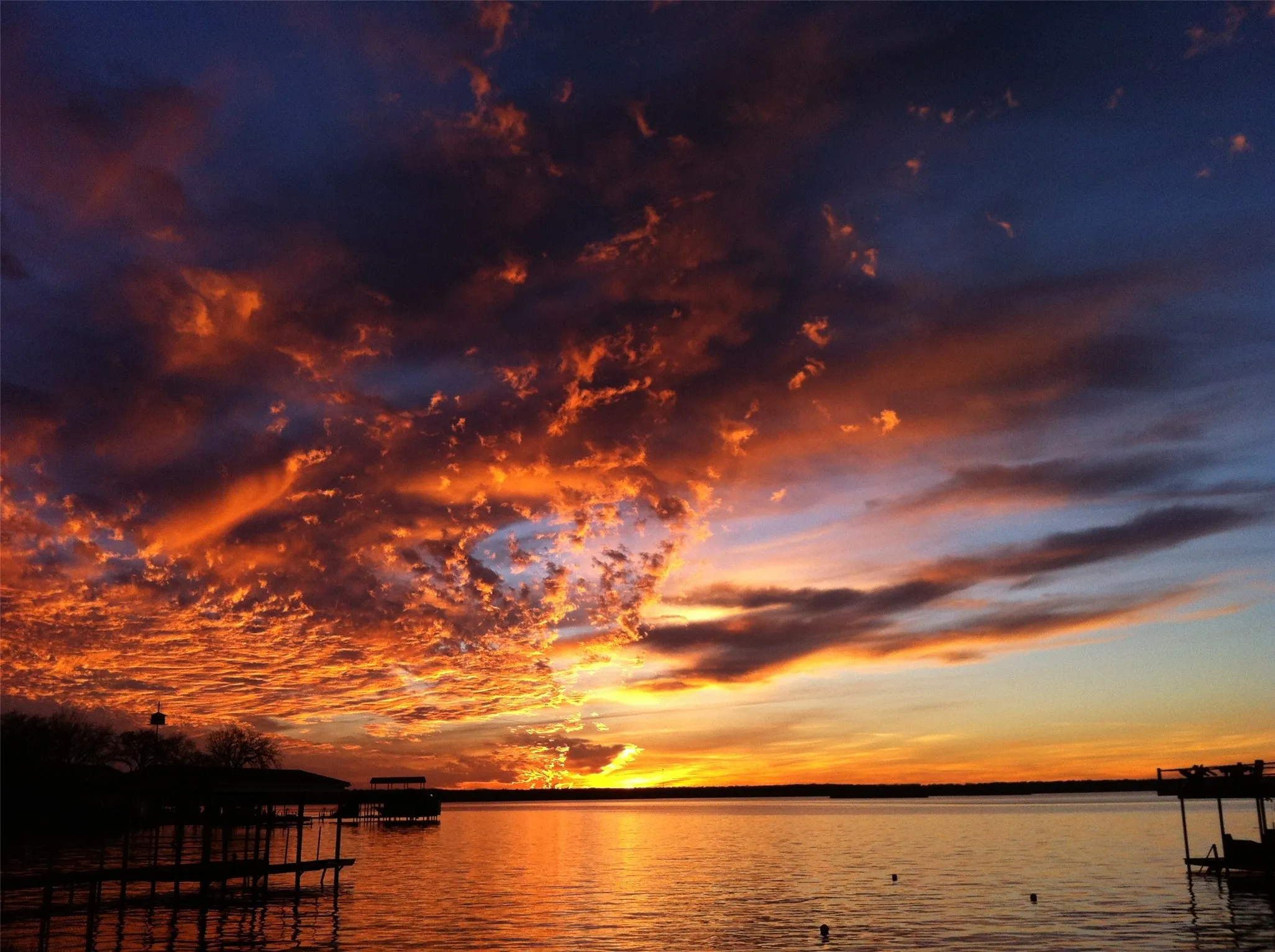 Lakefront setting with a vibrant sunset