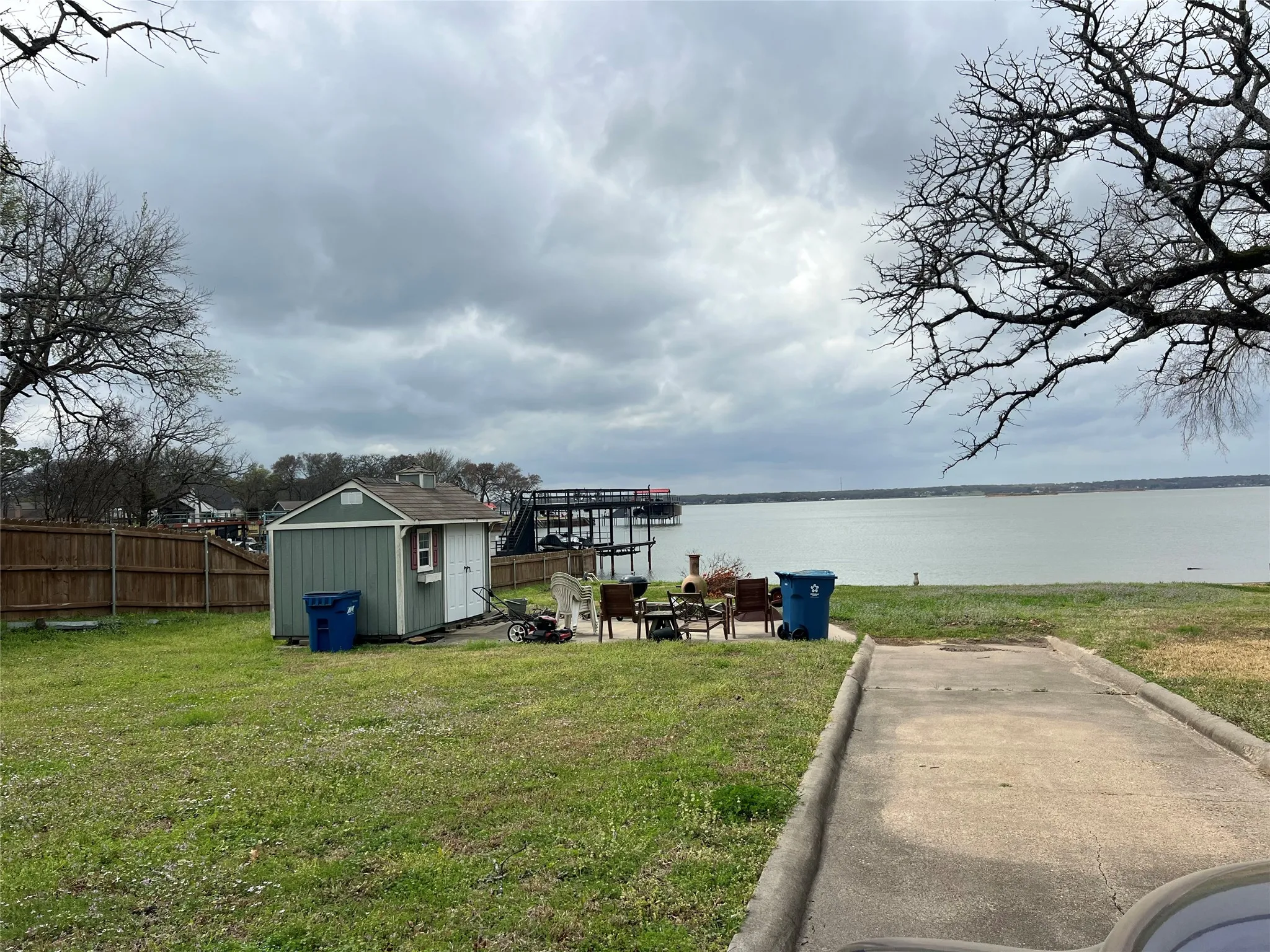 Expansive waterfront lawn with direct water access