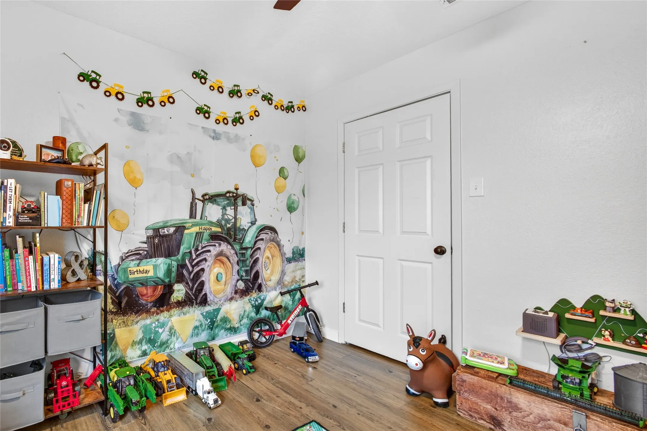 Recessed lighting illuminates wood-finish flooring
