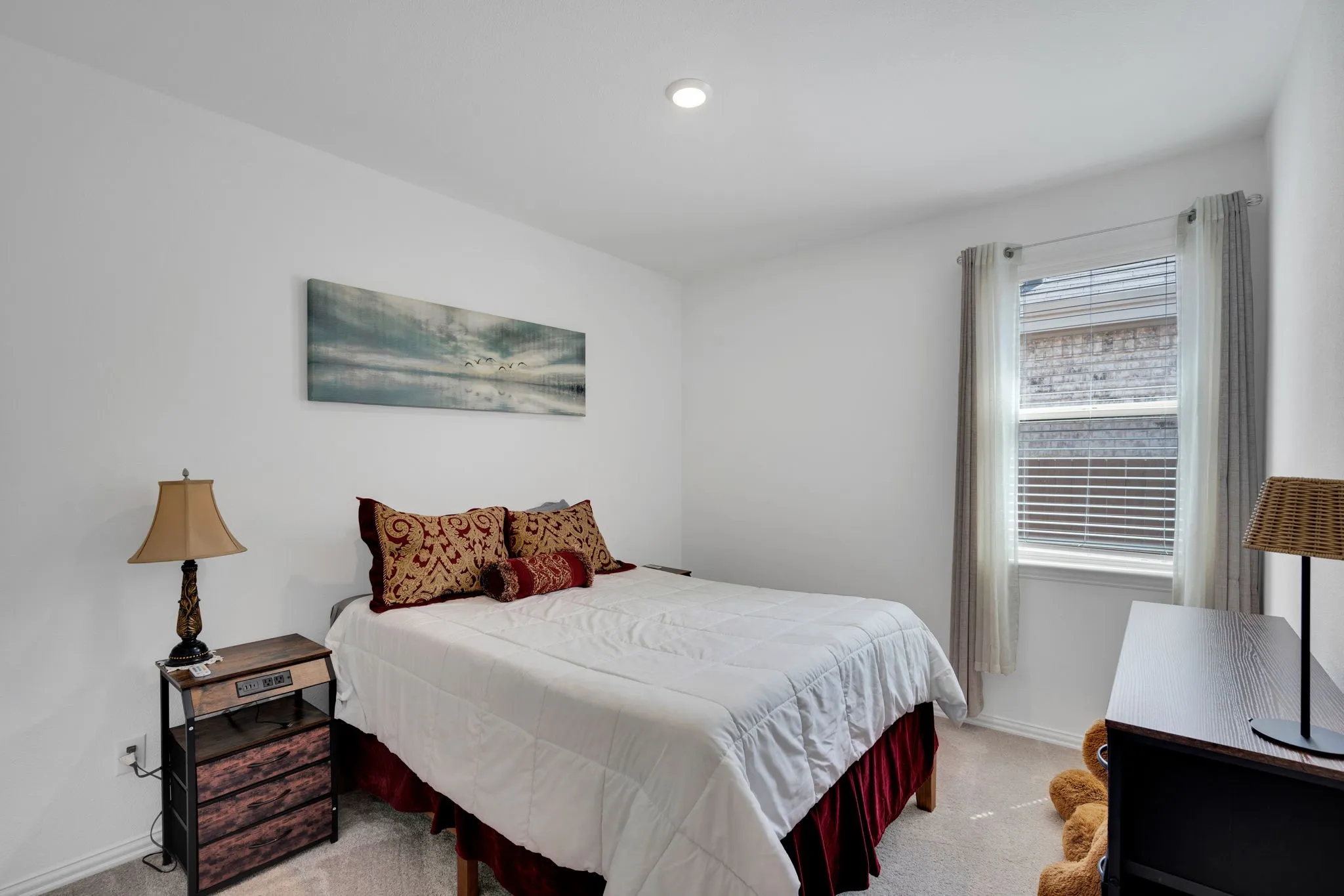Neutral white walls with recessed ceiling lighting