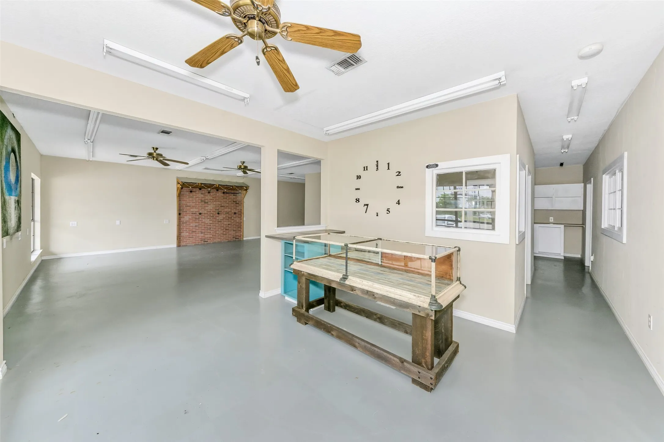 Expansive interior space featuring light-toned walls and a consistent flooring finish