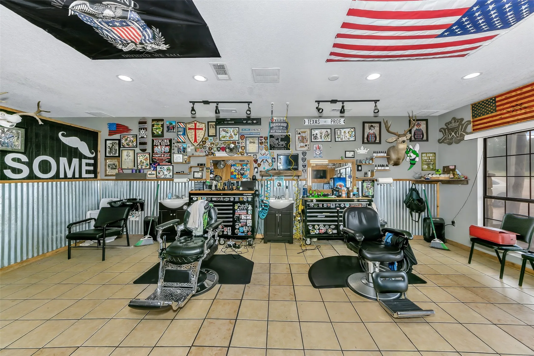 Commercial space featuring tile flooring and corrugated metal wainscoting