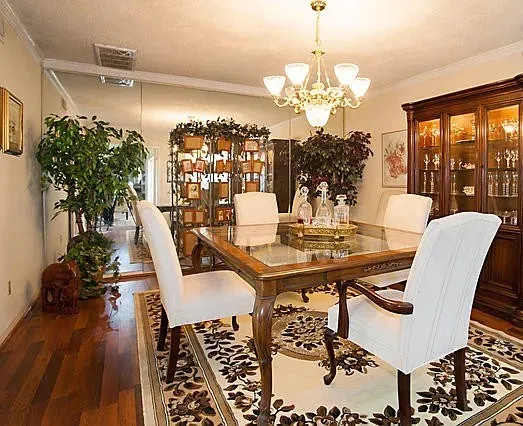 Large dining room with mirrored wall